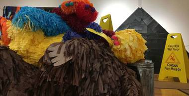 Among the highlights is Favela’s “Untitled (Muppet Pile),” featuring eight Jim Henson creations, from Slimey to Snuffleupagus, in a belly-up heap. Rendered life-size in piñata medium, their perky colors and adorable faces seem at odds with their compromised positions.