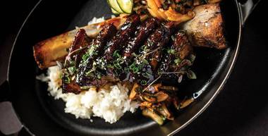 Served with red beans, white rice, Scotch bonnet and roasted carrots, the braised Jamaican oxtail is a dish so rich and complex in flavor, you’ll be thinking about it long after the last morsel of meat falls off the bone.