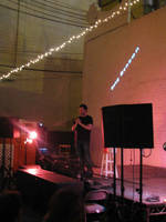 Doug Benson performs in the backyard at Beauty Bar for 125 eager listeners