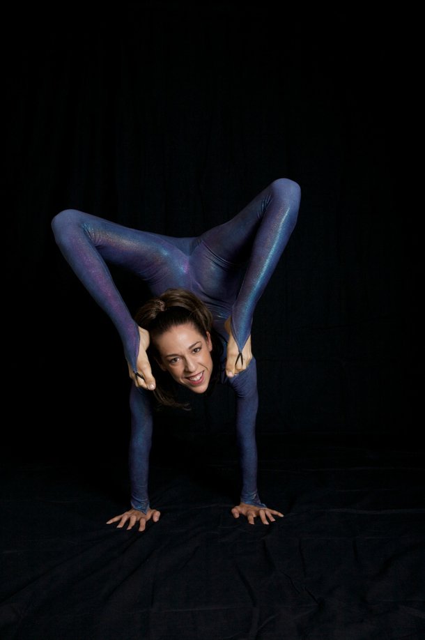 This multi-talented contortionist uses some interesting parts of her body to play a mean game of billiards.