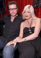 Tori Spelling places a restful hand on Dean McDermott.