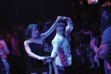 Cristina Ventre and Tony Rico practice their moves at the South Point Casino.
