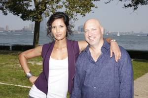 Padma Lakshmi and Tom Colicchio of Bravo's <em>Top Chef</em>. They look friendly enough until it's "pack your knives and go" time. 