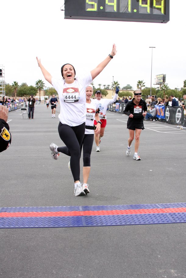 702.tv host (and my roommate) Denise Spidle leaps across the finish line of the Vegas marathon, her first, on December 7. 