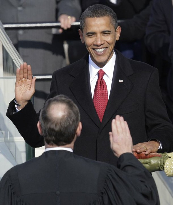 Barack Obama takes the oath of office from Chief Justice John Roberts to become the 44th president of the United States at the U.S. Capitol in Washington.