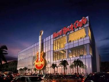 This artist rendering of the new Hard Rock Cafe - Las Vegas Strip shows the 60-foot guitar that will also house the building’s elevator. It does not show the giant Coca Cola bottle that will be its neighbor. 