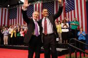 Senate Majority Leader Harry Reid, left, (D-Nev.) and President Barack Obama wave as they conclude a town hall meeting at Green Valley High School in Henderson Friday, February 19, 2010.