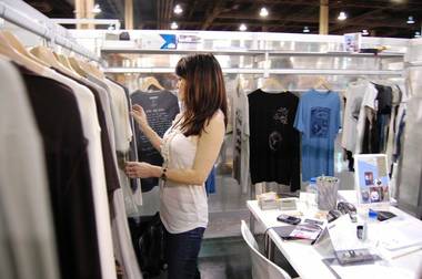 Substance founder Patricia Zeto looks through shirts at her company’s booth at PROJECT this past week. Zeto and partner Linda Werner started their hemp clothing line in August 2008 to inform consumers of the environmental benefits of the U.S.-banned plant.