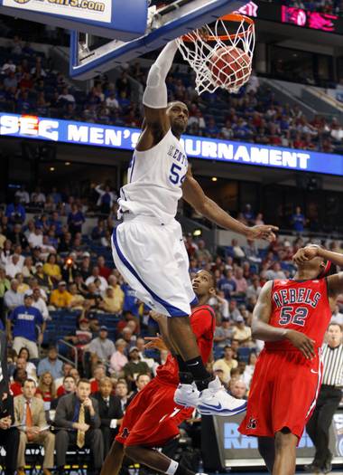 Kentucky’s Patrick Patterson dunks past Mississippi defenders, including Deaundre Cranston (52) during the first half of an NCAA college basketball game at the Southeastern Conference men’s tournament Thursday, March 12, 2009, in Tampa, Fla.