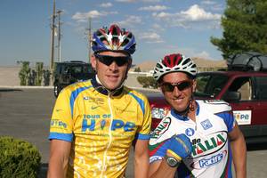 Ryan Pretner is shown with Lance Armstrong during a fundraising ride. Ryan, 37, suffered a fractured skull and was in a coma for more than 60 days after he was struck on the back of the head by a truck's side mirror Jan. 12, while he was cycling on St. Rose Parkway