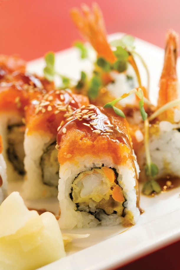 Tiger Roll: Fried shrimp rolled with rice, seaweed, and spicy tuna on top.