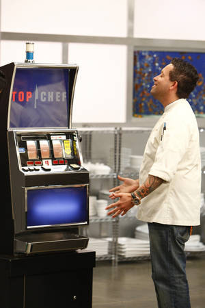 Michael I. consults the Quickfire slot machine for his three words to cook by on <em>Top Chef: Las Vegas</em>.