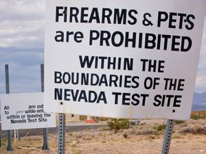 This sign guards a gate at the Nevada Test Site. 