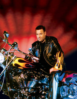 A leather-clad Steve Wyrick atop a motorcycle.