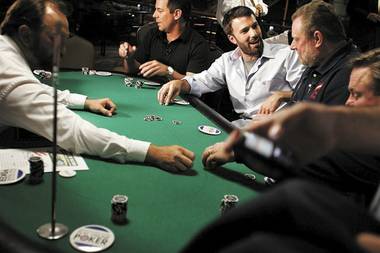 Actor Ben Affleck talks with Bill Lawson, vice president of the Paralyzed Veterans of America, the group that benefited from the charity poker tournament at Coors Field organized by the Poker Players Alliance on Aug. 28, 2008. Affleck will be among A-list stars playing Thursday, July 2, 2009, at the Ante up for Africa charity poker event at the Rio in Las Vegas.