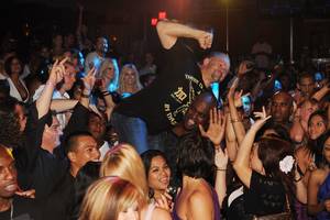 Former UFC champion Chuck Liddell is hoisted above the crowd during a performance by rapper Nelly at Jet.