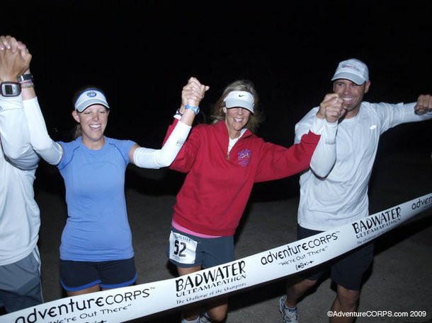 Molly Sheridan crosses the Badwater Ultramarathon finish line with her daughter and crew.