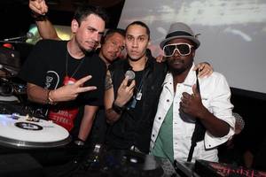 DJ AM, left, poses with, from left, DJ R.O.B and Black Eyed Peas' Taboo and Will.i.am early Saturday morning, Aug. 22, 2009, at Rain in the Palms in Las Vegas.