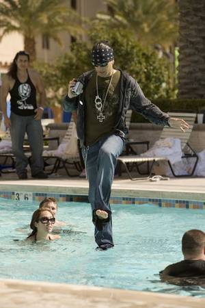 Criss Angel walks on (swimming pool) water.