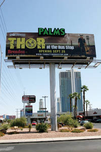 Thor on the billboard promotes <em>Thor at the Bus Stop</em>