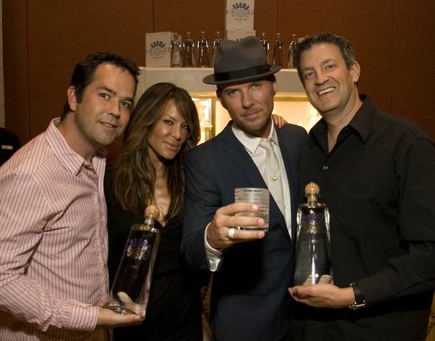 Pussycat Dolls creator Robin Antin and performer Matt Goss with Karma Tequila co-founders Devin Semler and Gary Eisenberger in the swag room at the Andre Agassi Foundation Grand Slam for Children.