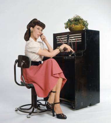 Lily Tomlin portrays telephone operator Ernestine.