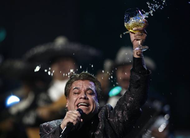 Juan Gabriel raises a glass during his epic performance at the 10th Annual Latin Grammy Awards on Nov. 5, 2009.