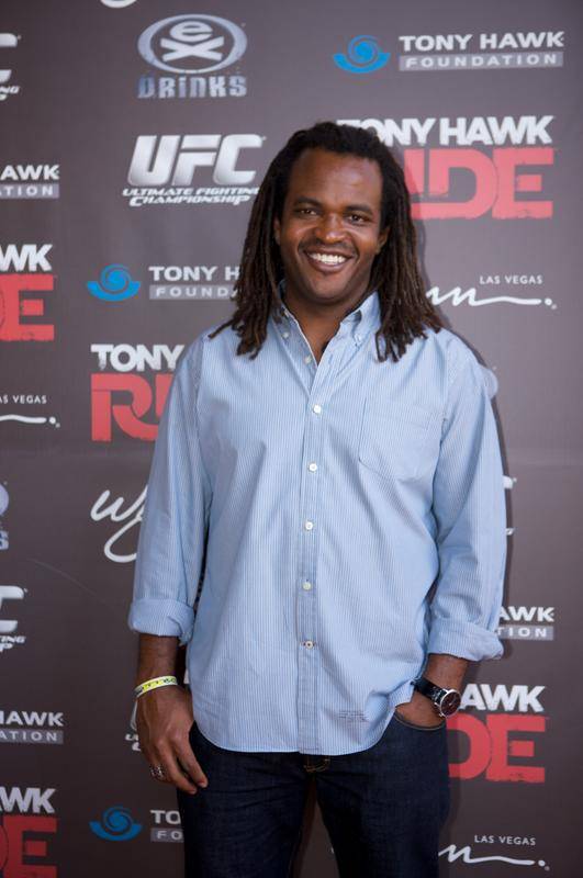 E! personality and former action sports commentator Sal Masakela smiles on the red carpet at Stand Up for Skateparks.