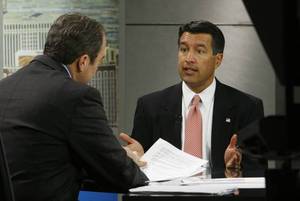 Brian Sandoval, right, discusses his candidacy for governor with Jon Ralston on Wednesday during an appearance on <em>Face to Face With Jon Ralston</em> at the KLAS-TV, Channel 8 studios.