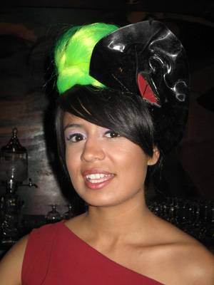 Bartender Alicia Sanchez models her unique melted record chapeau.