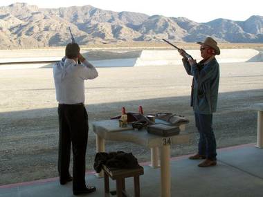Firing the first shots, Nevada state Sen. John Lee, left, and Clark County Commissioner Tom Collins officially open the new Clark County Shooting Park on December 19.