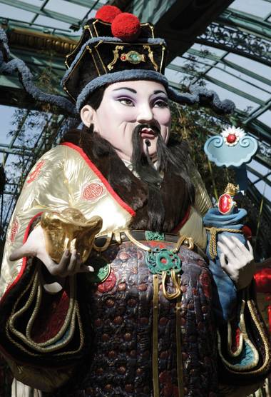 Lucky charm: A Chinese god of prosperity presides over the Bellagio Conservatory & Botanical Gardens.
