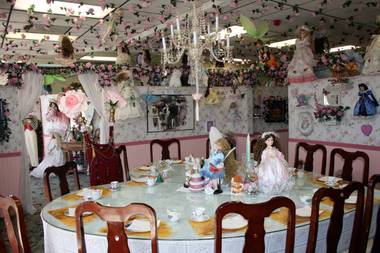 The heart shaped dining table, complete with throne, at Olivia’s Dollhouse Tea Room.