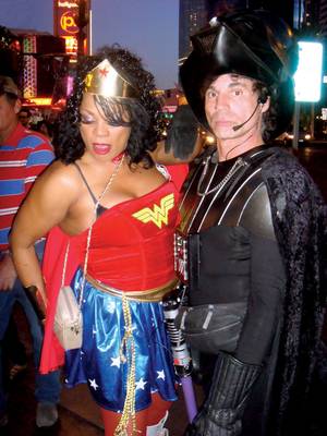 Strip Stake: Wonder Woman and Darth Vader work the street for tourist tips.