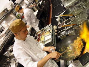 An order of Pad Thai gets under way at Wazuzu. Want to know how a Thai chef's feeling? Watch how he makes his Pad Thai.