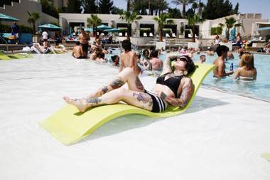Chani Murat lounges at Wet Republic’s Tattoosdays before winning the contest. 