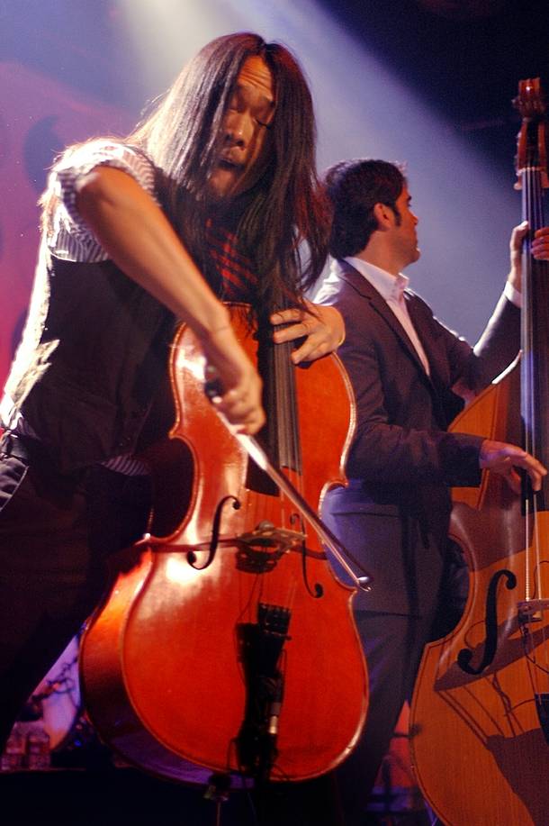 Joe Kwon performs with The Avett Brothers