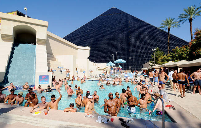 People wade in the pool during Temptation Sundays at the Luxor. The event is an LBGT pool party held at the casino on Sundays during the summer months. 