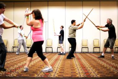 Students practice their technique during the Jedi Fighting Masterclass at Combatcon in the Tuscany Casino in Las Vegas Friday, June 24, 2011.