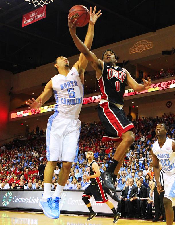 UNLV's Oscar Bellfield is guarded by University of North Carolina's Kendall Marshall during their Las Vegas Invitational championship game Saturday, Nov. 26, 2011 at the Orleans Arena.