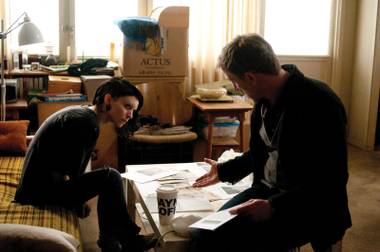 Rooney Mara and Daniel Craig gather clues.