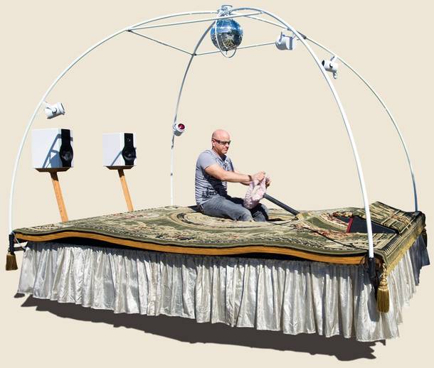 Michael Childers takes a ride in his magic carpet car.