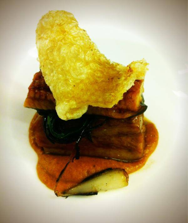 Pork belly, confit of young eel and pork crackling in tomato jus.