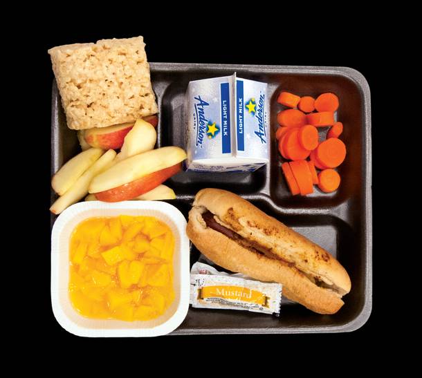 This is a real school lunch. Served to kids at Matt Kelly Elementary School in North Las Vegas. Under the USDA's new nutrition standards, going into affect for the coming school year, the whole wheat bun on the chili cheese dog and the two servings of fruit get to stay. The marshmallow square? Only two grain-based desserts will be allowed per week.