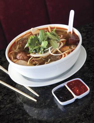 Pho Bosa's <em>bun bo hue</em> will change your life, if you're man enough for a volcanic beef noodle soup with cubes of ginger-infused pork blood.