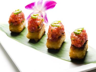 Koi’s crispy rice is addictive all by itself, but it comes topped with Kobe beef, yellowtail tartare, or here, spicy tuna.