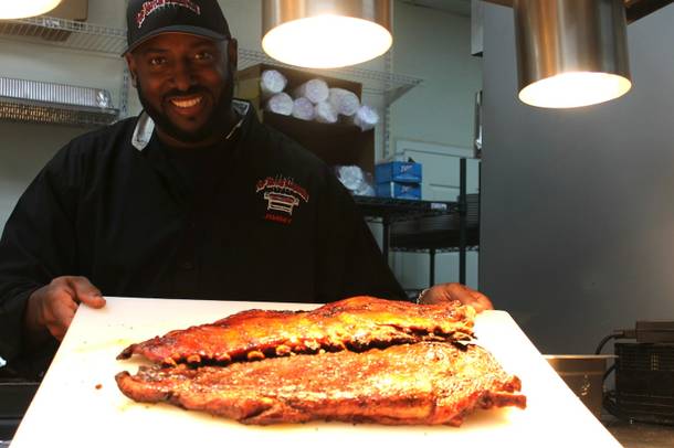 Top Notch Barbeque chef/owner Jimmy Cole with the best ribs in the city.