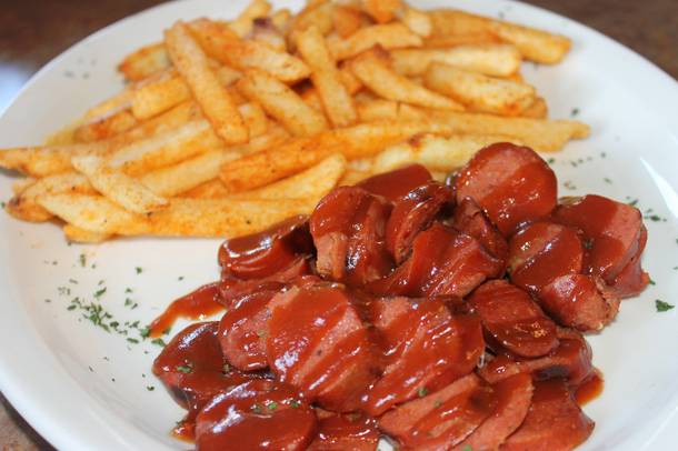 A plate of hot links and fries at Top Notch Barbeque.