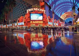 Bill Hughes documents a wet night on the Fremont Street Experience full of rock and straight-faced art.