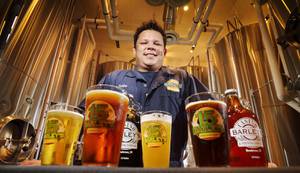 Barley's brewmaster, Bubba, shows off his crop of beers.